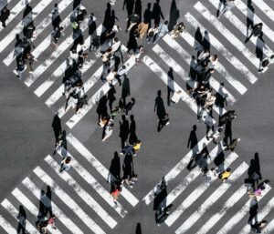 aerial view of people walking on cross pedestrian lane